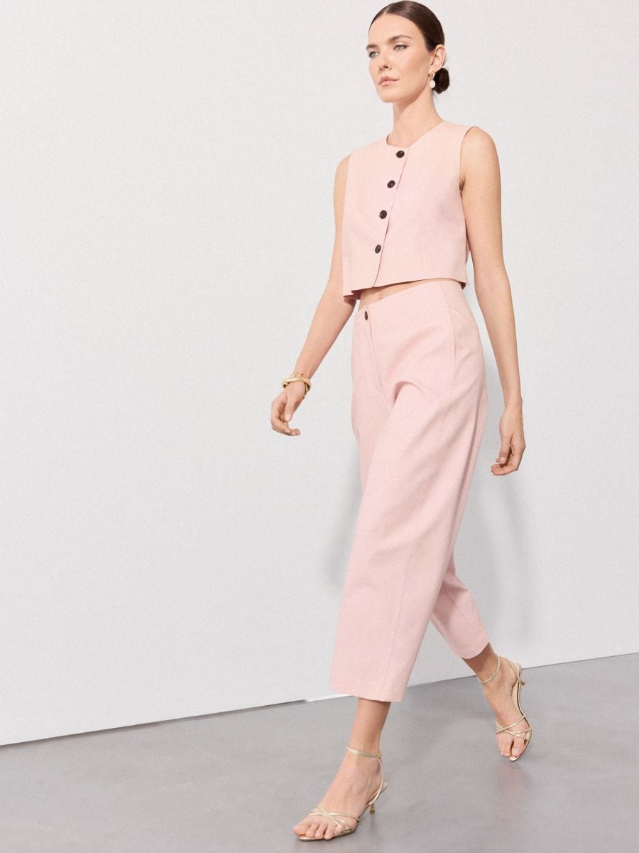 Spodnie slouchy - pastelowy różowy - MOHITO
