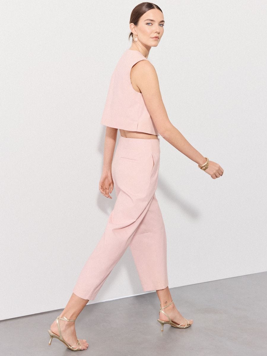 Spodnie slouchy - pastelowy różowy - MOHITO