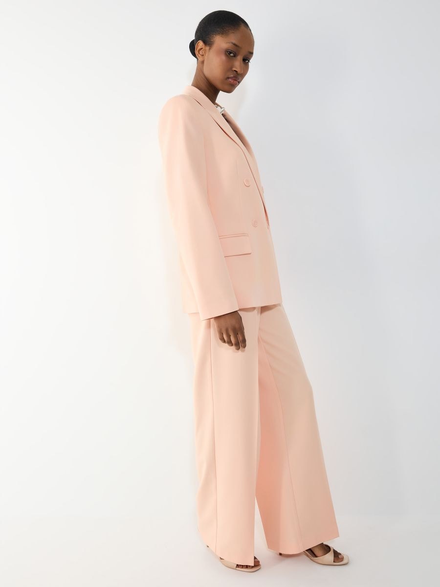 Spodnie wide leg - brzoskwiniowy - MOHITO