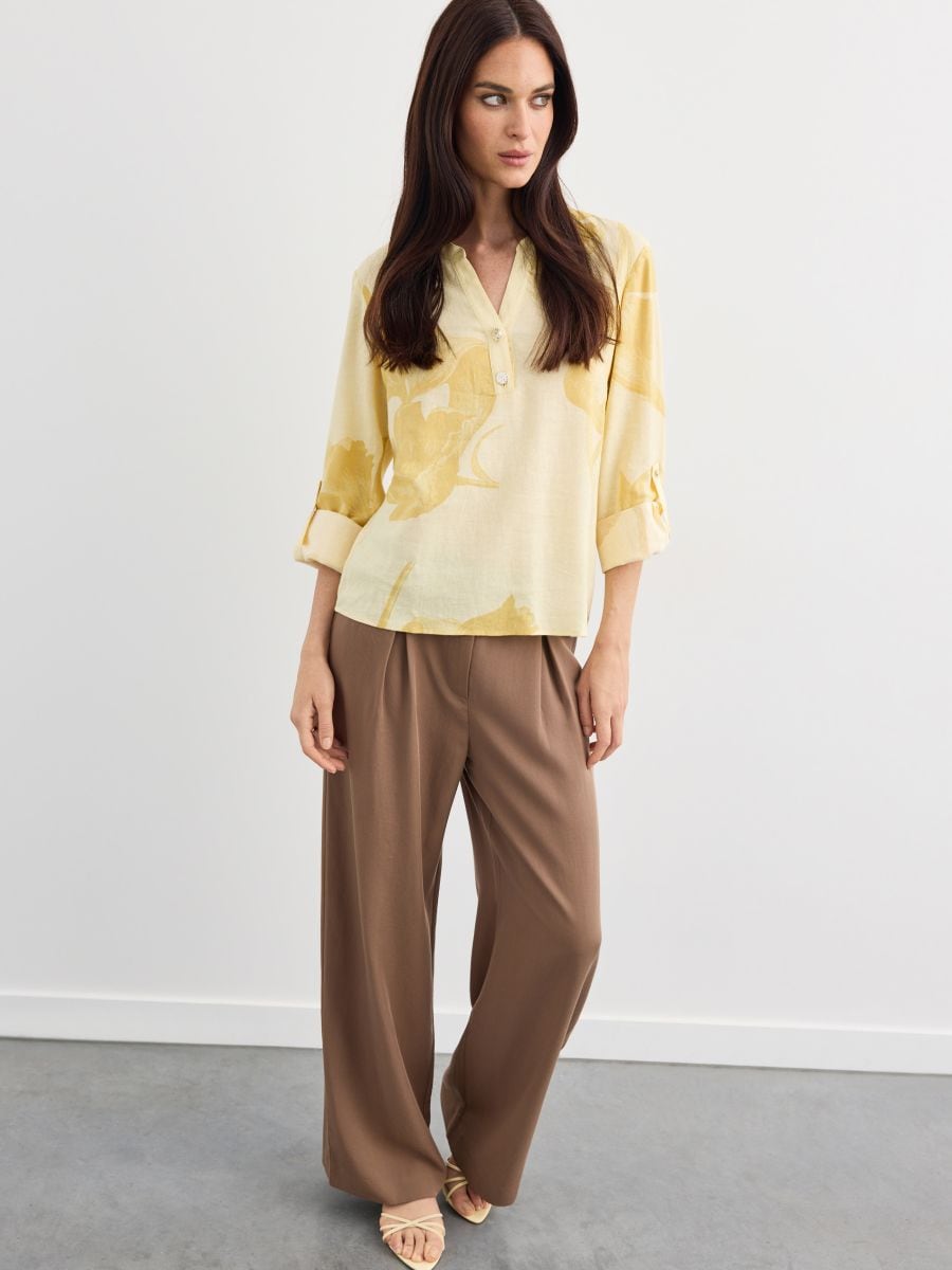 Spodnie wide leg z lyocellu - brązowy - MOHITO
