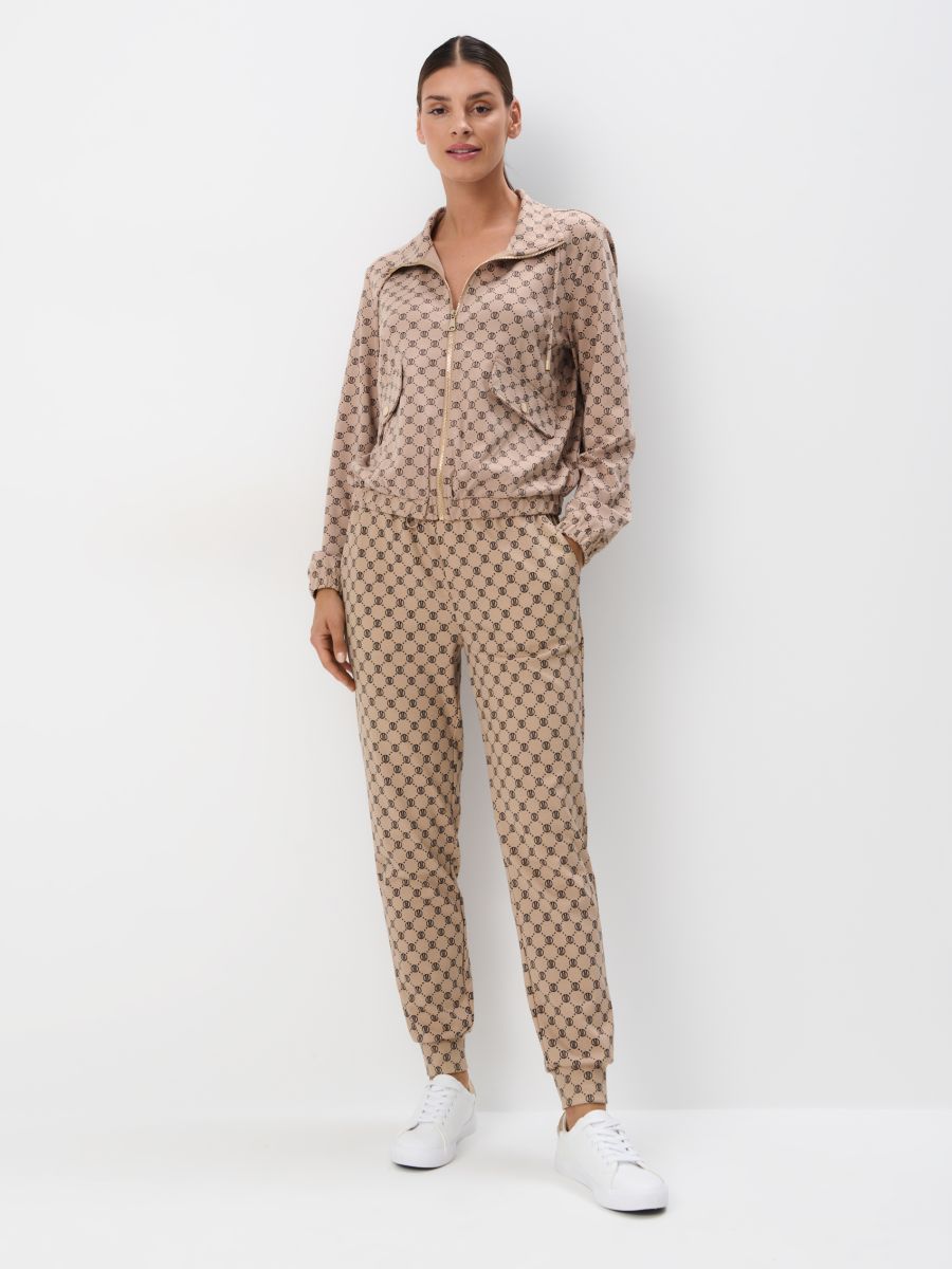 Spodnie dresowe w monogram - beżowy - MOHITO