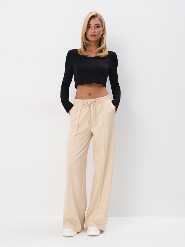 Beżowe spodnie dresowe Kolor beżowy - MOHITO - 695CZ-08X